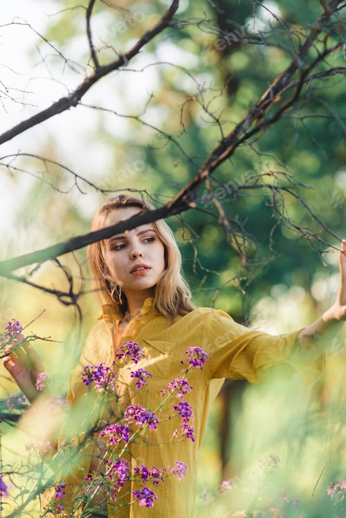 Preview: Dreamy Woman in a Sunny Field with Flowers