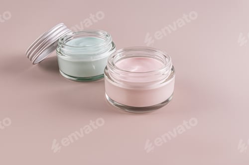 Preview: Two open cosmetic jars with a natural cosmetic product for self-care. Organic cosmetics. Coloured