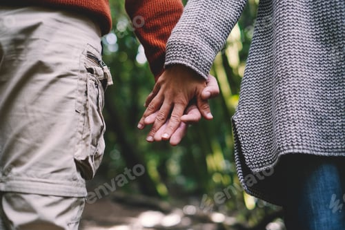 Preview: Close up of man and woman couple hands holding each other together with love