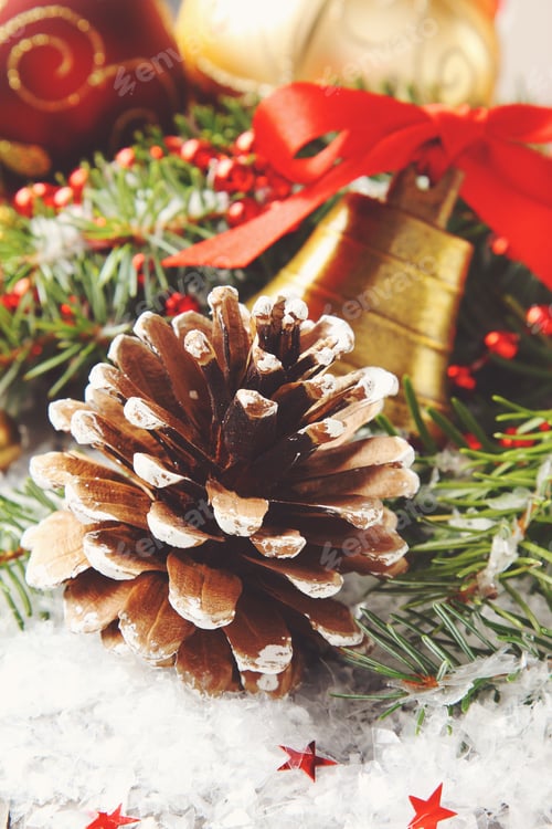 Preview: Pinecone with christmas decoration and snow