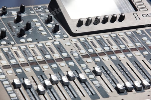 Preview: Sound mixer console detail with sliders and levels. Audio