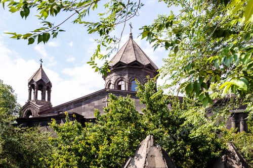 Preview: Cathedral between green leaves in Gyumri city