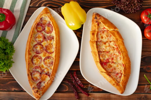 Preview: Pide - Turkish baked bread on wooden table