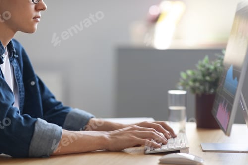 Preview: Young Man Trading Online, Checking Financial Statistics While Working On Computer