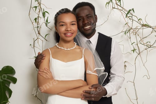 Preview: Young black couple as bride and groom embracing