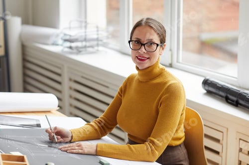 Preview: Smiling Female Engineer Working in Office
