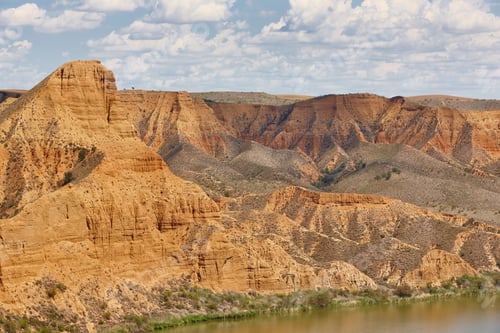 Preview: Red clay erosion gully and river. Eroded landscape. Spain