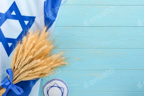 Preview: Shavuot jewish background. Ripe bouquet of wheat with blue ribbon with Israel flag and backgrounds.