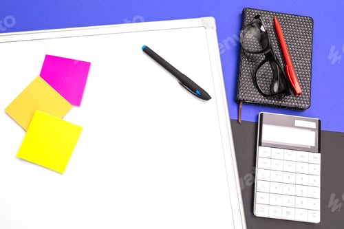 Preview: Modern workplace with office-board, pen and calculator isolated on blue black background