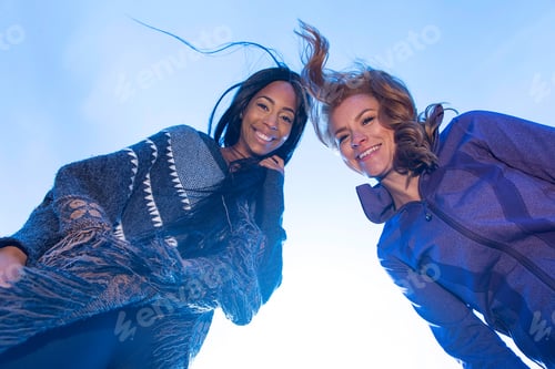 Preview: Twowoman looking down at camera
