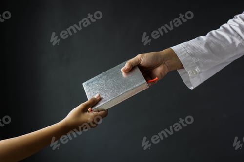 Preview: Muslim hands giving Holly Quran