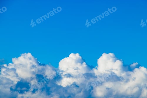 Preview: Pure white clouds on a blue sky. A symbol of purity and dreams. Background for design.