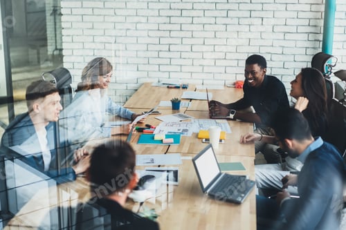 Preview: Employees during collaboration in conference room