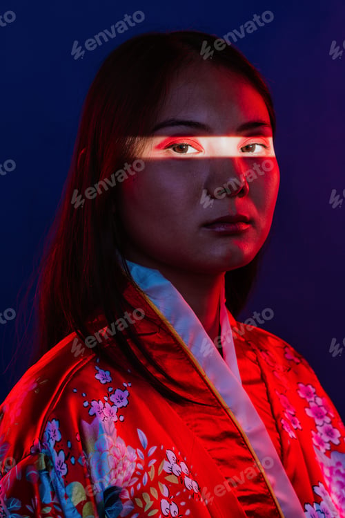 Preview: Asian woman wearing traditional kimono with red light