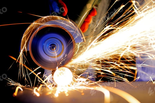 Preview: Worker cutting metal with grinder