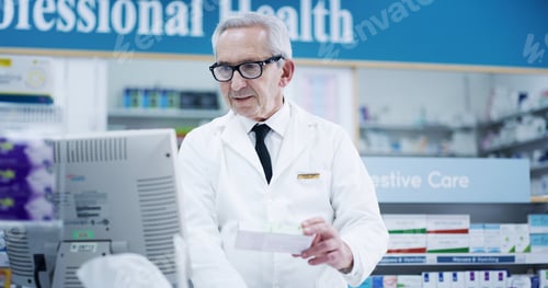 Preview: Mature, pharmacist and man with drugs on computer for inventory check, online order and pills dispe