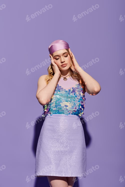 Preview: Stylish young woman showcases vibrant spring fashion against a pastel purple backdrop