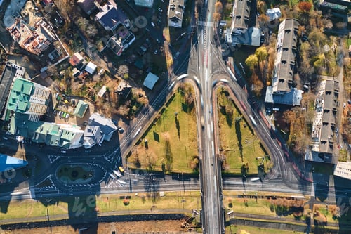 Preview: Aerial view of road intersection with fast moving heavy traffic on city streets