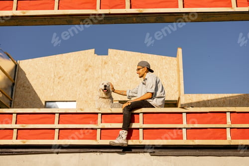 Preview: Man with his dog on construction site