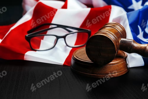 Preview: Gavel on wooden table with USA flag