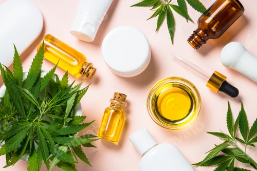 Preview: Cannabis oil, cream, soap and fresh leaves at white