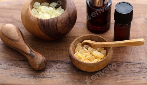 Preview: Chios mastic tears and essential oil on wood background