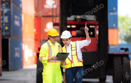 Preview: Portrait of Asian woman engineer and worker working with co-worker at overseas shipping container
