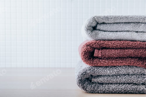 Preview: Towels. Clean fresh fluffy towels on table in bathroom