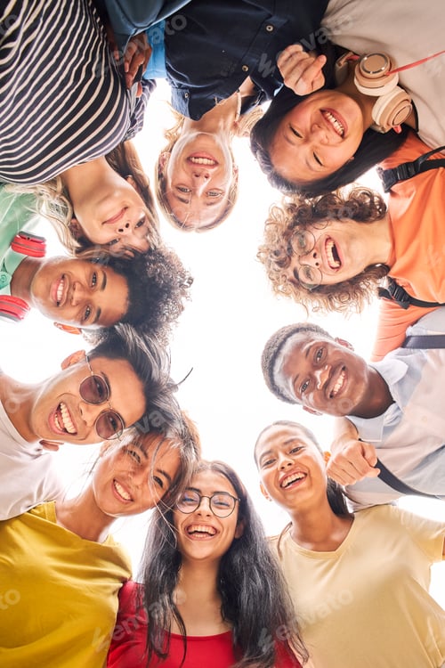 Preview: Vertical photo of a group of students are together, happy and smiling.