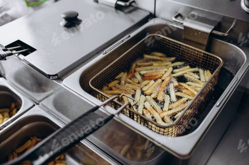 Preview: Cooking french fries in the deep fryer, crispy fries, Junk food concept