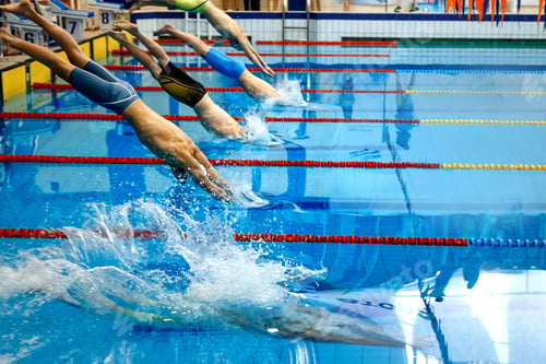 Preview: Swimmers Diving into a Pool for Competition