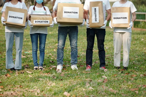 Preview: Volunteers with donation boxes