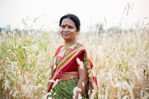 Preview: Smiling woman farmer in agricultural field