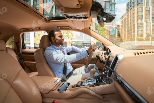 Preview: Careful young driver driving his motor vehicle