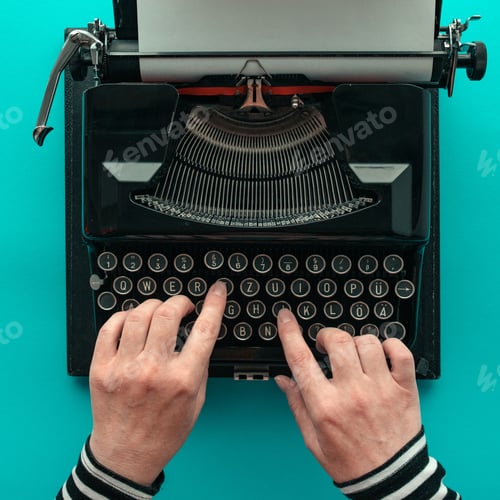 Preview: Woman typing vintage typewriter, top view