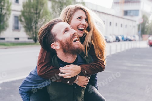 Preview: Young couple hugging outdoor smiling