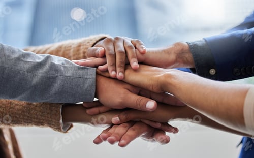 Preview: We have to motivate each other. Shot of a group of people with their hands stacked.