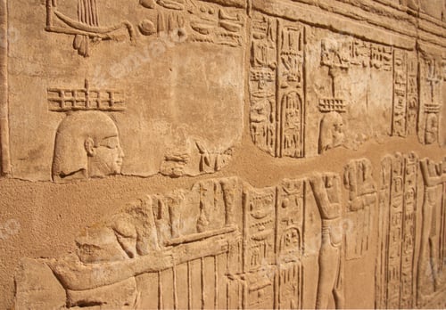Preview: Ancient Egyptian murals hieroglyphs on stone wall in Karnak temple Luxor, Egypt.
