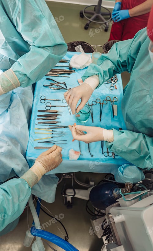 Preview: Surgical Instruments Laid Out on Table During Procedure