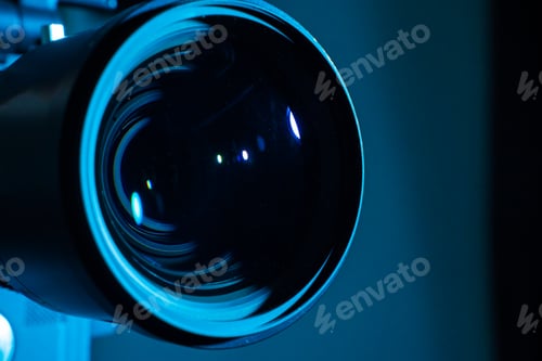 Vista previa: Close-up of a digital camera lens with dark light. Copy space for text.