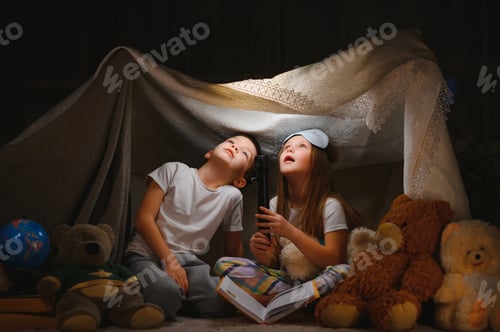 Preview: Little children reading bedtime story at home