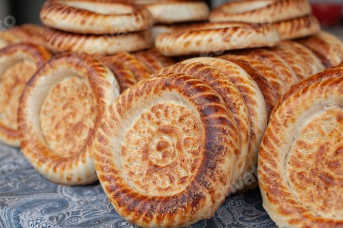 Preview: Typical traditional flatbread with crunchy crust with sesam just baked