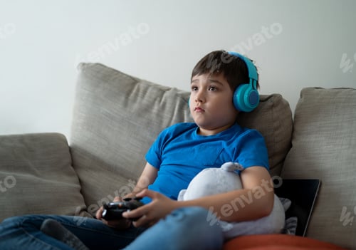 Preview: Boy Relaxing on Couch Playing Video Game