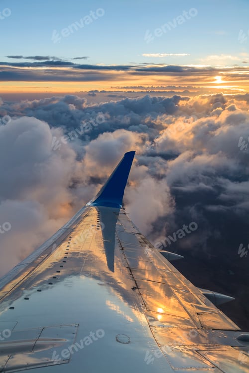 Preview: View of the clouds and airplane wing from the Inside