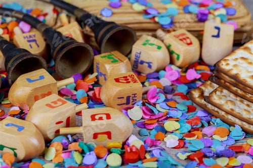 Preview: Jewish holiday Stacks of Chanukah, gelt, large dreidel the traditional Jewish toy, a spinning top