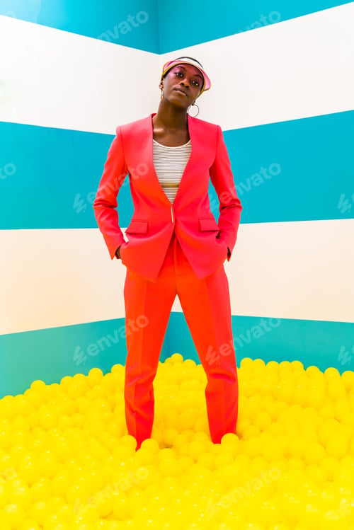 Preview: Beautiful young woman posing and having fun inside a rainbow box room