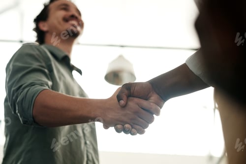 Preview: Shot of a two unrecognizable businessmen standing in the office together and shaking hands