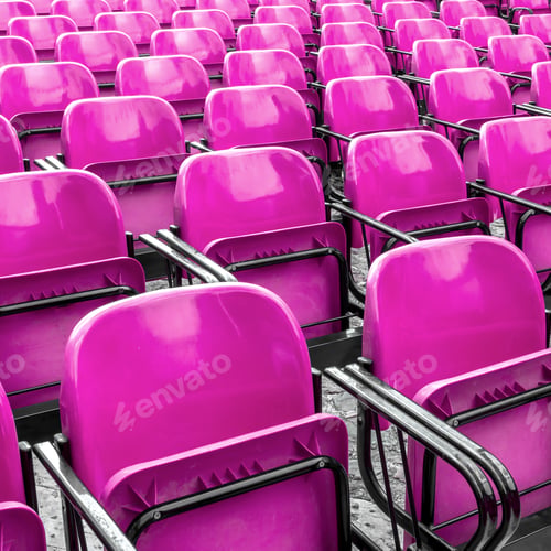 Preview: Empty plastic pink chairs