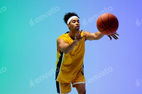 Preview: Image of biracial basketball player throwing basketball on green to blue background
