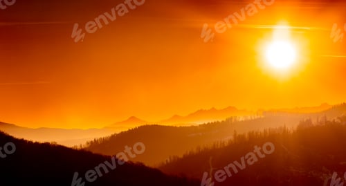 Preview: Panoramic dreamy view of sunrise above mountains